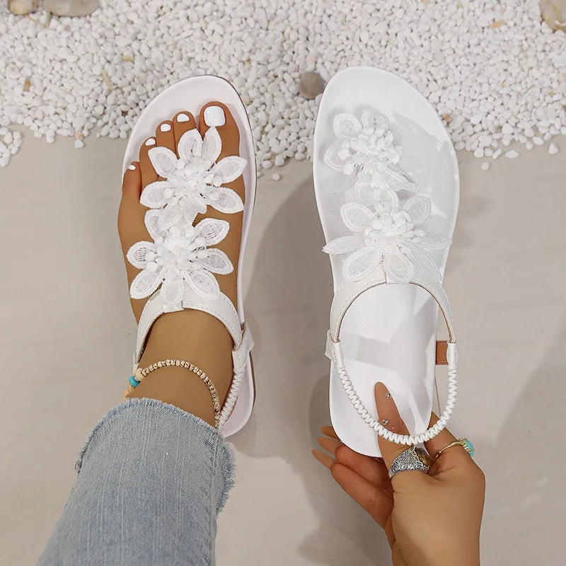 Women Casual Flat Bottom Sandals 2026 Summer New Style Flower Decor Elastic Band Clip Toe Sandals Comfort Non Slip Female Shoes