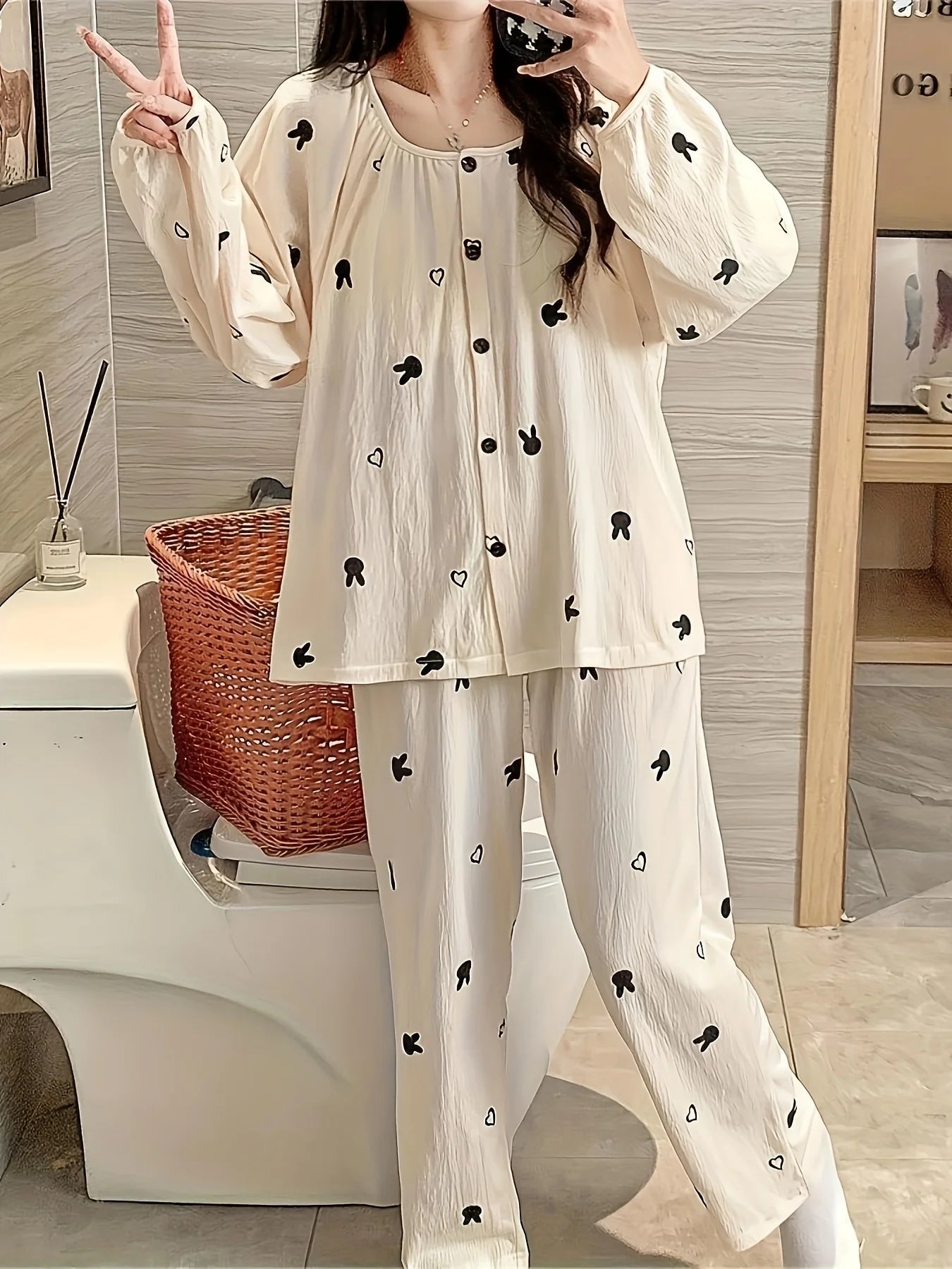 Women's loungewear pajama set features a cardigan - style with a round - neck design, rabbit pattern, long sleeves and long pant